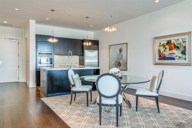 Dining space with recessed lighting, dark wood-style floors, and a chandelier