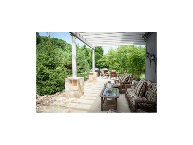 Outside oasis featuring a fountain, pergola, firep