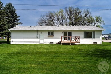 Back of the house with sliding galss door to the b