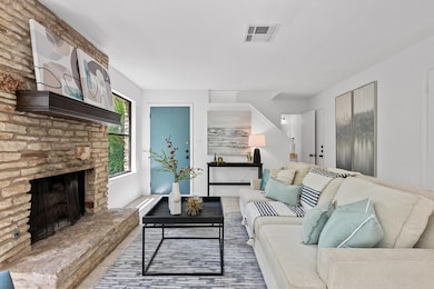 Living room featuring visible vents and a large f