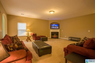 The great room features a cozy fireplace....