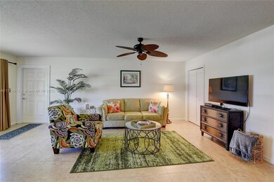 LIVING ROOM WITH FRONT DOOR ON LEFT SIDE AND EXTRA