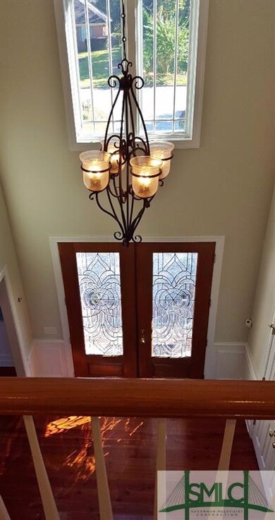 Upper-level view of gorgeous front doors and entry