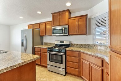 Granite Counters and Island Open to Living Space