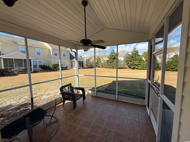 Unfurnished sunroom featuring vaulted ceiling and ceiling fan