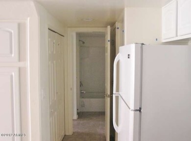 KITCHEN LOOKING INTO THE LAUNDRY AREA