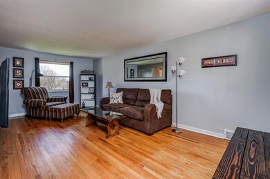 Lovely hardwood floors adorn the spacious living r
