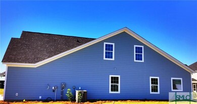 This single story plan offers a guest suite upstai