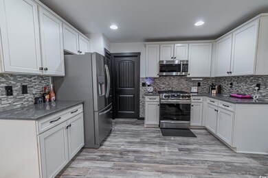 Kitchen featuring appliances with stainless steel 