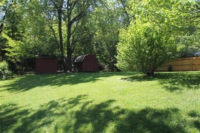 Large treed yard with 2 storage sheds