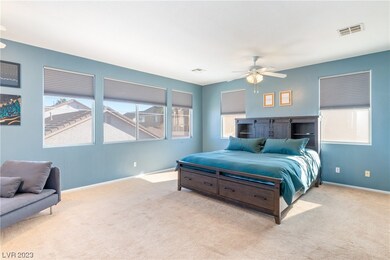 The upstairs primary suite offers a luxurious retr