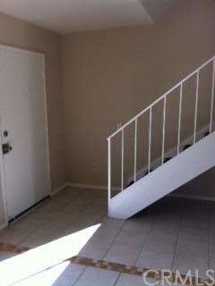 Entry Way With Ceramic Tile & Staircase