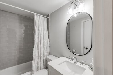 Full bath downstairs with connection to hallway an