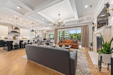 Luxury Living Room with coffered ceiling and gas fireplace