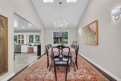 Dining space featuring high vaulted ceiling, a sky