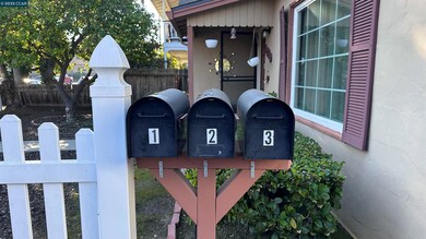 Mail boxes for 3 units in the back