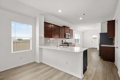 Kitchen featuring appliances with stainless steel
