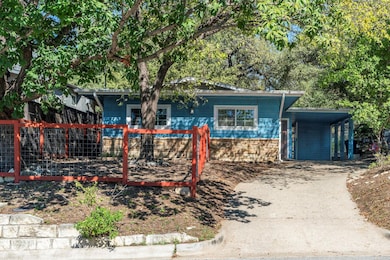 View of front of house with concrete driveway, a 