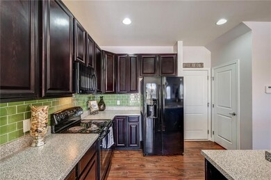 Doors off the Kitchen go to the two car Garage or 