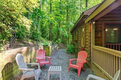 View of patio / terrace featuring a wooded view