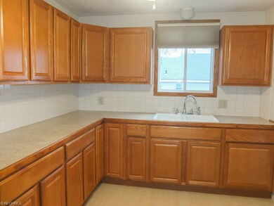 Kitchen has ample counter space and tile backsplas