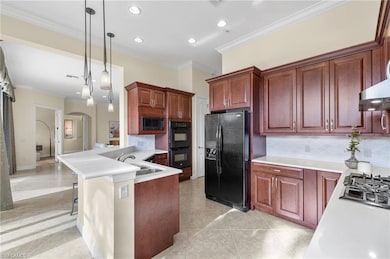 Kitchen featuring sink, hanging light fixtures, cr