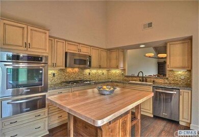Kitchen with granite and stone backsplash...also n