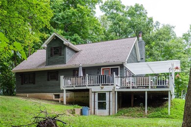 Large sectional deck on side and rear of house, gr