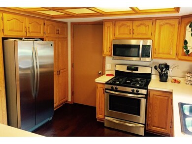 Kitchen features brand new stainless appliances.