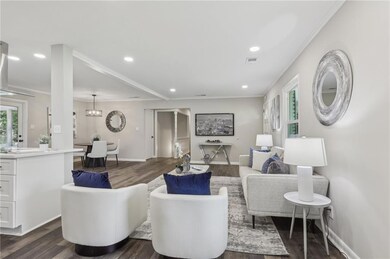 Living area featuring dark wood finished floors, r
