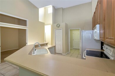 Open kitchen facing bonus room/den/office with poc