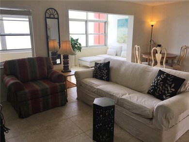VIEW OF LIVING ROOM FROM CLOSET DOOR AREA