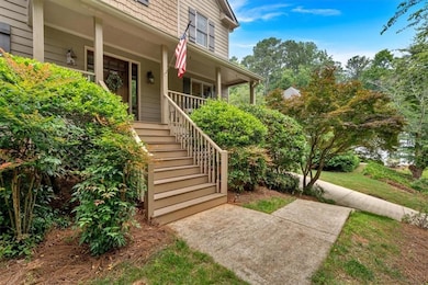 Entrance to property featuring covered porch
