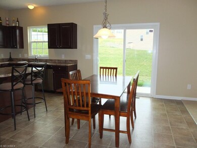 Dinette with slider to back patio.