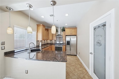 Kitchen with stainless steel appliances, visible v