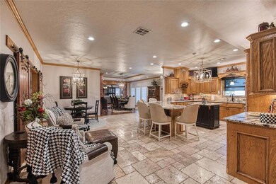 Living room featuring ornamental molding, a barn d