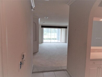 Entry foyer, kitchen to the right, dining room and
