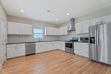 Kitchen featuring appliances with stainless steel