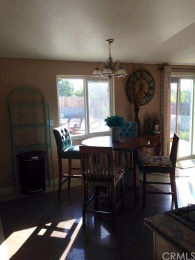 Large windows and slider door from living room/din