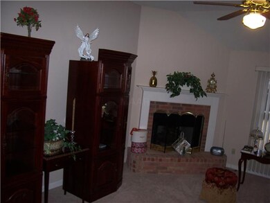 Large great room with fresh paint and new carpet. 
