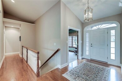 Photo shows front entry, office, stairs to basement and hallway to master bedroom and bedrooms 2 & 3.  Gleaming hardwood floors refinished in 2018!