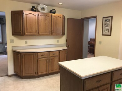 Oak cabinets throughout.  The island is movable. K