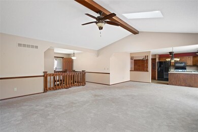 Vaulted ceilings with skylight and beam