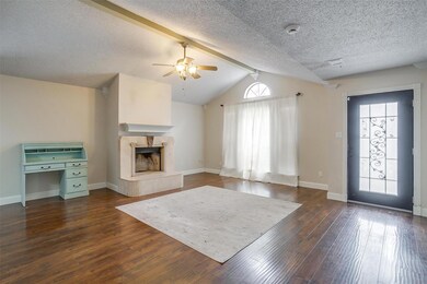 Unfurnished living room with a textured ceiling, l