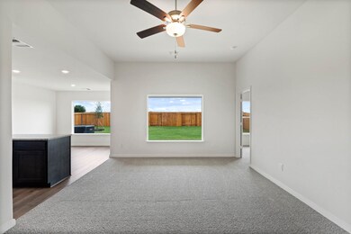 Spare room with recessed lighting, dark colored carpet, and ceiling fan