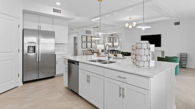 A double-basin sink and pull-down faucet make post-meal clean-up a breeze