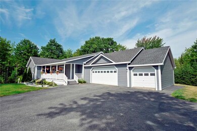 Large, paved driveway with 3 car garage.