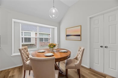 Virtually Staged_Dining room featuring light hardw