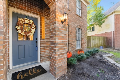 Looks like home to me! Class brick exterior and solid wood front door at your inviting porch.