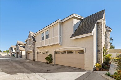 Enchanting French Tudor Style townhome is move-in ready, centrally located, and has a private end unit location.